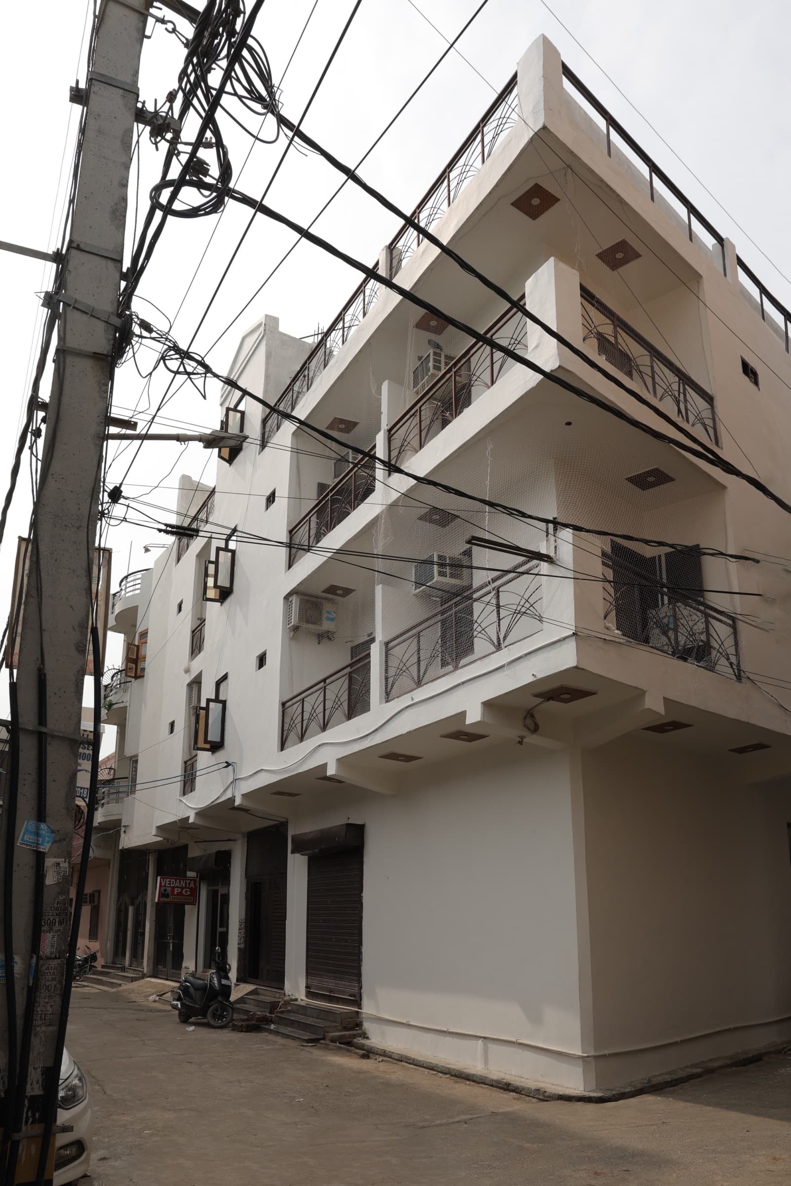 Wide street view of Vedanta PG