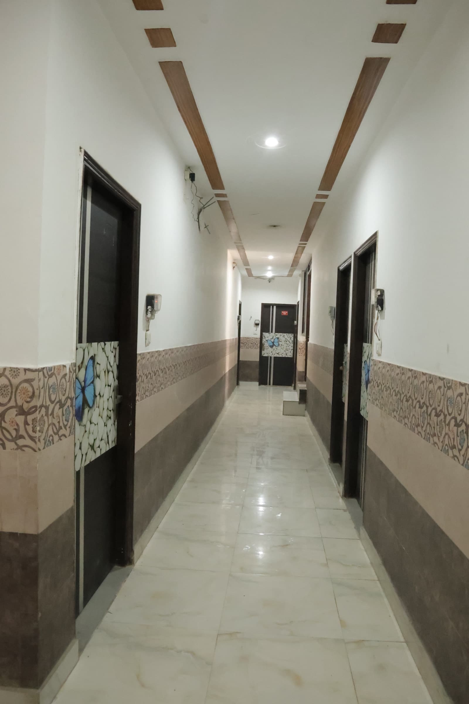 Well-lit interior corridor at Vedanta PG
